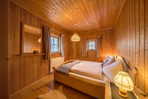 Katil atau katil-katil dalam bilik di Thaler-hof Ferienhaus Lärchnhittl