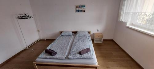 a bedroom with two beds in the corner of a room at Nad Morzem in Gdańsk