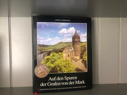 a book with a picture of an old church at Ferienwohnungen Margot in Iserlohn