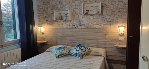 Tempat tidur dalam kamar di Agriturismo Poggio all'Olivo