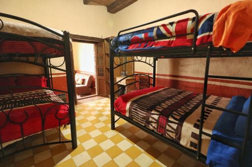 Ένα ή περισσότερα κρεβάτια σε δωμάτιο στο Hospedaje La Casa del Abuelo