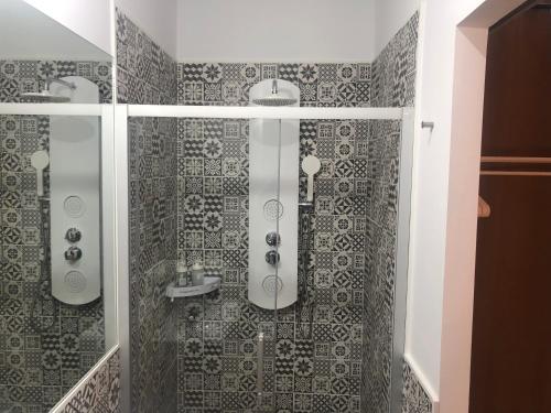 a bathroom with a shower and a sink at La Estación in Sanlúcar de Barrameda