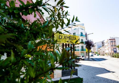 a yellow sign that says danger on a street at Dona Amélia Hotel by RIDAN Hotels in Fátima