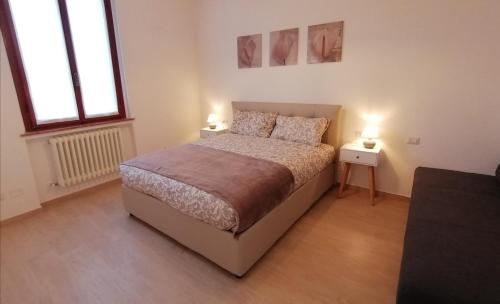 Ένα ή περισσότερα κρεβάτια σε δωμάτιο στο San Bartolo Rent Apartments, due passi da Firenze