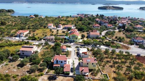 an aerial view of a small town next to the water at Apartmani Juresko Mrljane in Mrljane