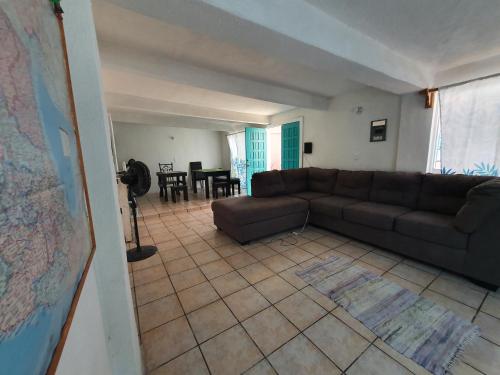 a living room with a couch and a table at Nómadas Hostel in La Paz