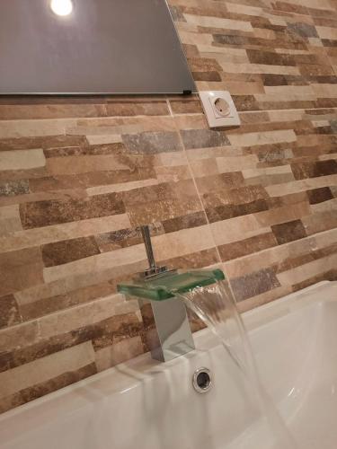 Ένα μπάνιο στο Apartamento GIJON LOS CAMPOS