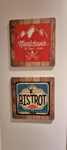 a bottle of root beer and a sign for a brewery at Luxury Central Apartment MONTCHAVIN in Bellentre