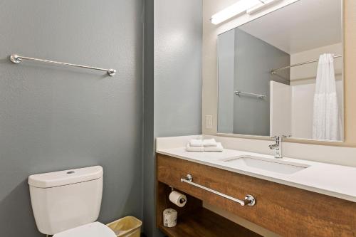 a bathroom with a sink and a toilet and a mirror at Extended Stay America Suites - San Jose - Mountain View in Mountain View