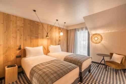 Postel nebo postele na pokoji v ubytování Mercure Peyragudes Loudenvielle Pyrénées
