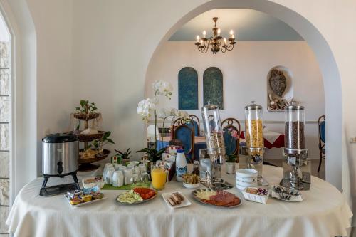 a table with food and drinks on top of it at Villa Amigo in Podstrana