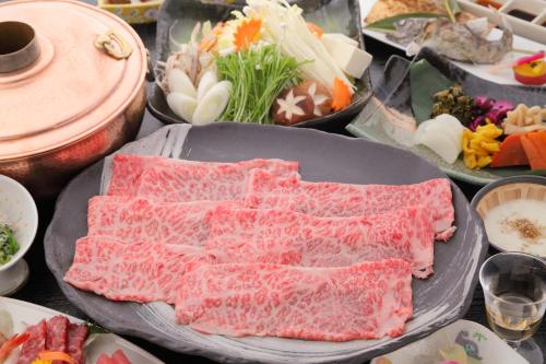 a bunch of different types of food on a table at Hotel Yumeshizuku in Minami Aso