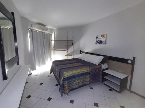 Gulta vai gultas numurā naktsmītnē Copacabana - Hotel Flat Real Residence - 500 metros da Praia