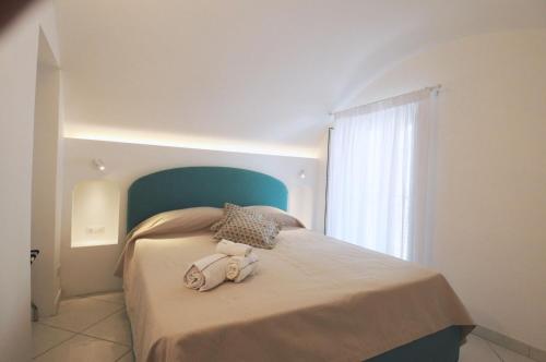 La Piazzetta by Amalfi Dreams tesisinde bir odada yatak veya yataklar