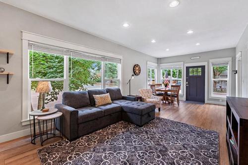 a living room with a couch and a table at Cozy Chic Home In Downtown Loveland! in Loveland