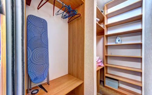 a surfboard in a walk in closet at 1к квартира метро Лук'янівка, Юрія Іллєнка 49 in Kyiv