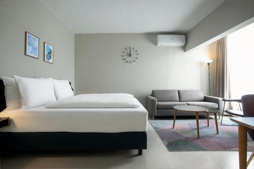 Rúm í herbergi á Nordic Hotel Lagos