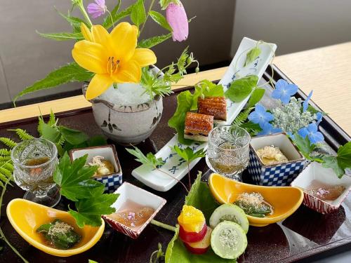 a tray filled with different types of food on a table at Okushiga Kogen Hotel in Yamanouchi