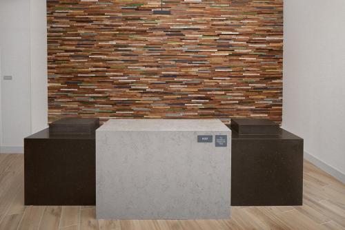 a brick wall with two boxes in front of it at Hyatt Place Murfreesboro in Murfreesboro