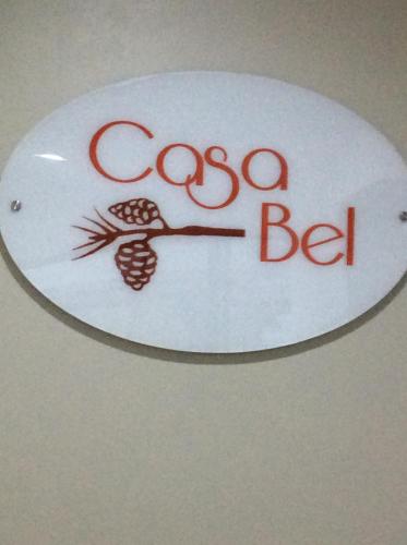 a sign for a coca cola sign with a bird on it at Casa Bel in Baguio