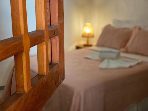 Ένα ή περισσότερα κρεβάτια σε δωμάτιο στο Maruê Guesthouse Porto de Pedras