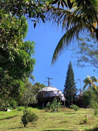 a gazebo with a cross and a tree at Eco-Glamping Shalom in Mariquita