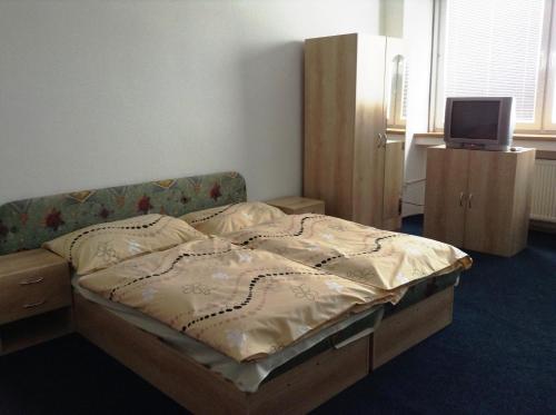 Postel nebo postele na pokoji v ubytování Hotel Dom techniky
