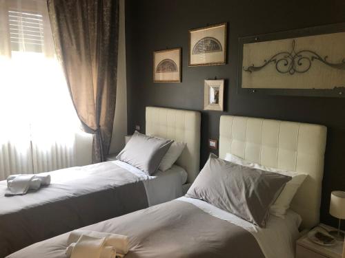 Ένα ή περισσότερα κρεβάτια σε δωμάτιο στο Villa Ciocca