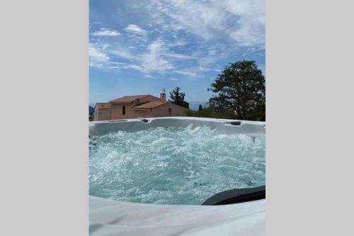 a jacuzzi tub with water in it at Rêves de vie, le "Port Miou" perle rare à Cassis in Cassis