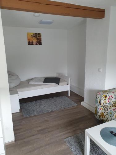 a living room with a bench in the corner at Andrews Ferienwohnungen in Tangermünde