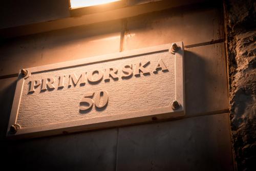 a sign on the side of a building with the word frimunicipalities at Apartments Bora in Neum