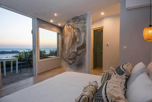 Ένα ή περισσότερα κρεβάτια σε δωμάτιο στο Adrakos Apartments (Adults Only)