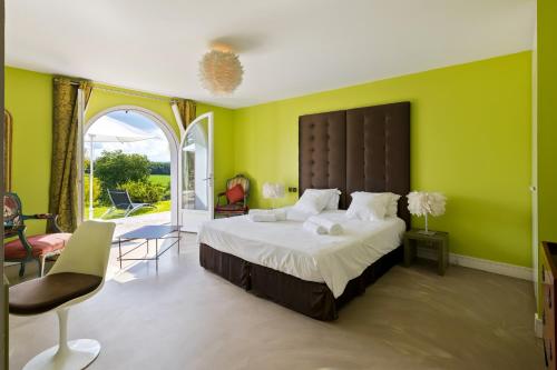 Postel nebo postele na pokoji v ubytování Villa ARGUIBEL