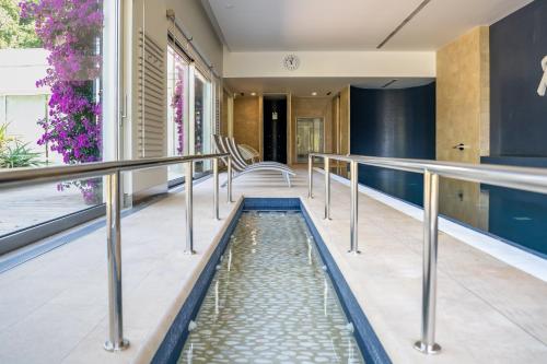 a pool of water in the middle of a house at Rinoterra Minho in Caminha