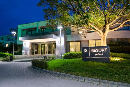 a building with a sign in front of it at D Resort Gocek Special Category in Göcek