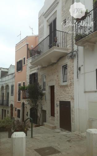 a building with a balcony on the side of it at DonMattè - Charme & Rooms in Conversano