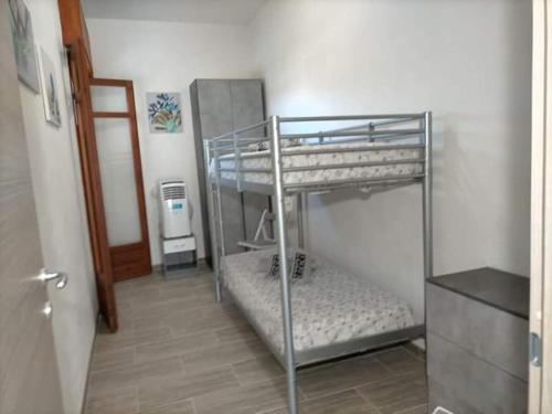 Ein Bett oder Betten in einem Zimmer der Unterkunft Casa Vacanze Samuel Beach
