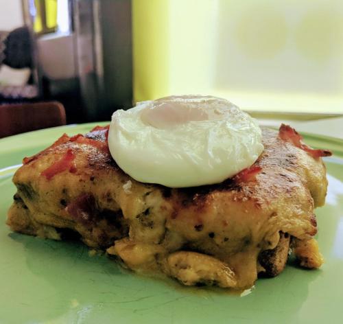 a piece of food with an egg on top on a plate at The Bear Bread Bakery B&B, Ensuite rooms above the Bakery, Colyton in Colyton