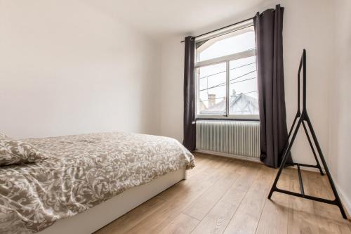 Katil atau katil-katil dalam bilik di Appartement Croisé Laroche 2 (12min de Lille)