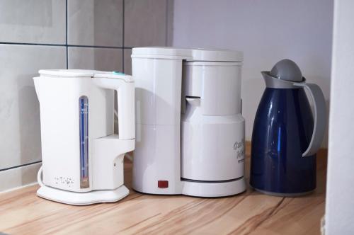 a group of appliances sitting on a kitchen counter at Appartement Heidi in Viehhofen