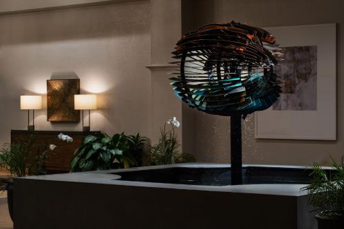 a bath tub in a room with a blue glass ball at Hyatt Regency Westlake in Westlake Village