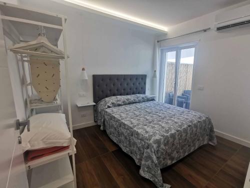 Posteľ alebo postele v izbe v ubytovaní Sorrento Punto It Apartment