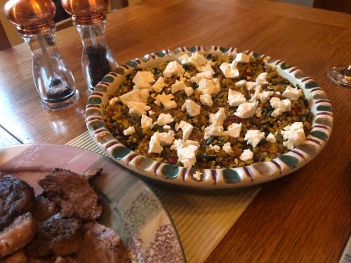 a table with a pie and a plate of food at Foresters Lodge bed and breakfast, near loch ness in Inverfarigaig