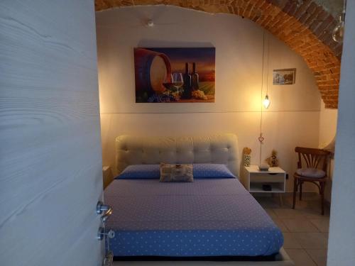 Un pat sau paturi într-o cameră la L'ANGOLO RELAX
