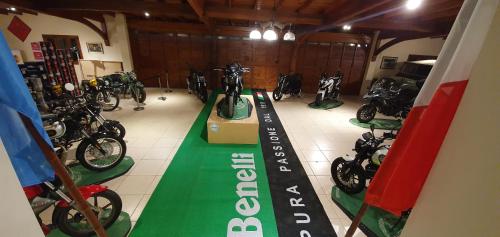 a motorcycle shop with motorcycles parked in a garage at Museo Posada Benelli in San Rafael