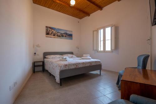 Posteľ alebo postele v izbe v ubytovaní LavatoioFlats Casa sul mare e sul lavatoio medievale a Cefalù