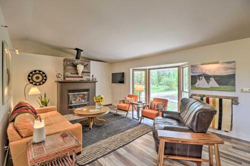 a living room filled with furniture and a fireplace at Montana Cottage Easy Drive to Glacier Natl Park! in Columbia Falls
