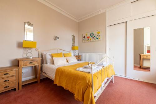 a bedroom with a bed and a dresser at Aberfeldy Lodge Guest House in Inverness