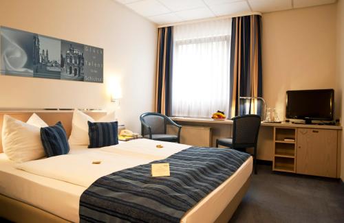 En eller flere senge i et værelse på Hotel Novalis Dresden