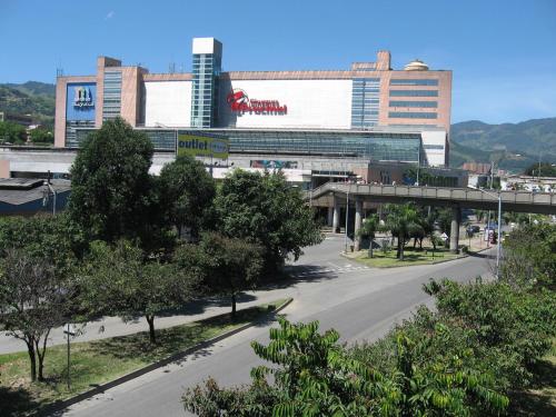 an empty street in front of a large building at Near El Poblado,New Modern,Turco,Jacuzzi & Pools in Sabaneta